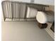 Clean bathroom featuring toilet, toilet paper storage and overhead shelving at 4480 Merrigold Way, Fairburn, GA 30213