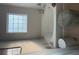 Modern bathroom with a soaking tub and a window at 4480 Merrigold Way, Fairburn, GA 30213