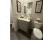 Stylish half bathroom featuring modern vanity and decor for added appeal at 4480 Merrigold Way, Fairburn, GA 30213