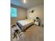 Inviting bedroom showcasing cozy bedding, a window, and decorative wall art at 4480 Merrigold Way, Fairburn, GA 30213