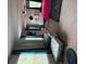 Cozy bedroom with sitting chairs and a window with blue curtains at 4480 Merrigold Way, Fairburn, GA 30213