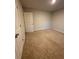 Neutral bedroom with closet door and carpeted flooring at 4480 Merrigold Way, Fairburn, GA 30213