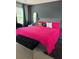 Comfortable bedroom features a large bed with a decorative pillow at 4480 Merrigold Way, Fairburn, GA 30213