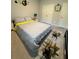 Well-decorated bedroom with stylish bedding, a clock, and unique wall decor at 4480 Merrigold Way, Fairburn, GA 30213