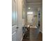 Well-lit entryway featuring modern console table, decor, and views into the living spaces at 4480 Merrigold Way, Fairburn, GA 30213