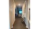 Well-lit entryway featuring modern console table, decor, and views into the living spaces at 4480 Merrigold Way, Fairburn, GA 30213