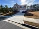 Traditional two-story home featuring a long driveway and well-manicured front yard at 4480 Merrigold Way, Fairburn, GA 30213