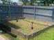 Backyard garden with string lights, great for outdoor gardening and ambiance at 4480 Merrigold Way, Fairburn, GA 30213