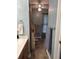 Bathroom with a vanity with tile floors and blue paint and multiple towel racks at 1131 Steeple Run, Lawrenceville, GA 30043
