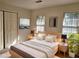 Staged bedroom with modern decor and two windows at 1131 Steeple Run, Lawrenceville, GA 30043