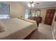 Neutral main bedroom with a large window, traditional furnishings, and carpeted floors at 1131 Steeple Run, Lawrenceville, GA 30043