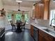 Eat-in kitchen featuring a bright breakfast nook with a large window and garden views at 1131 Steeple Run, Lawrenceville, GA 30043