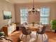 Bright dining room showcasing stylish furniture, ample natural light, and modern decor at 1131 Steeple Run, Lawrenceville, GA 30043