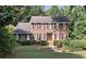 Charming two-story brick home with black shutters and a beautifully landscaped front yard at 1131 Steeple Run, Lawrenceville, GA 30043