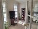 Bright office featuring natural light from windows, a bookcase, and neutral colored walls at 1131 Steeple Run, Lawrenceville, GA 30043
