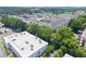 Wide angle aerial of an apartment complex surrounded by mature trees with easy access to parking at 1850 Cotillion Dr Unit 3416, Atlanta, GA 30338