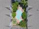 Aerial view of a residential complex and community pool and jacuzzi surrounded by mature landscaping at 1850 Cotillion Dr Unit 3416, Atlanta, GA 30338