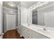 Bright bathroom features a double sink vanity, large mirror, and neutral color palette at 1850 Cotillion Dr Unit 3416, Atlanta, GA 30338
