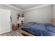 Neat bedroom features a bed, storage shelf, and plenty of natural light at 1850 Cotillion Dr Unit 3416, Atlanta, GA 30338