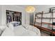 Bedroom boasts a bed with shelves and a closet, offering ample storage solutions at 1850 Cotillion Dr Unit 3416, Atlanta, GA 30338