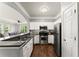 Bright kitchen featuring stainless steel appliances, granite countertops, with an open view to the comfortable living area at 1850 Cotillion Dr Unit 3416, Atlanta, GA 30338