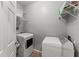 Laundry room featuring a washer, dryer, and storage shelves for organization at 1850 Cotillion Dr Unit 3416, Atlanta, GA 30338