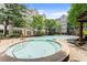 Sparkling community pool with lounge chairs, a hot tub, and a relaxing atmosphere at 1850 Cotillion Dr Unit 3416, Atlanta, GA 30338