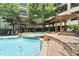 Community pool with built-in jacuzzi with a cascading waterfall feature at 1850 Cotillion Dr Unit 3416, Atlanta, GA 30338