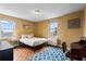 Bedroom with windows, parquet floor, radiator, overhead light, and neutral color scheme at 300 Peachtree Ne St # 20 O, Atlanta, GA 30308