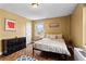 Bedroom with parquet floor, overhead light, radiator, bed and dresser with decorative art pieces at 300 Peachtree Ne St # 20 O, Atlanta, GA 30308