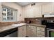 Modern kitchen with tile backsplash, granite countertops, and stainless steel appliances at 300 Peachtree Ne St # 20 O, Atlanta, GA 30308