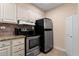 Kitchen featuring granite countertops and modern appliances at 300 Peachtree Ne St # 20 O, Atlanta, GA 30308