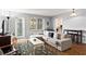 Comfortable living room features neutral colors and a balcony at 300 Peachtree Ne St # 20 O, Atlanta, GA 30308