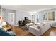Bright living room features hardwood floors, large window, and comfortable seating arrangement at 300 Peachtree Ne St # 20 O, Atlanta, GA 30308
