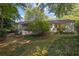 Backyard featuring mature trees, a screened in porch, and brick exterior at 4669 Dunover Cir, Atlanta, GA 30360
