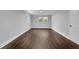 Neutral bedroom featuring hardwood floors, white trim, and natural light at 4669 Dunover Cir, Atlanta, GA 30360