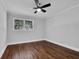 Clean bedroom featuring hardwood floors, recessed lighting, and a bright window with leafy views at 4669 Dunover Cir, Atlanta, GA 30360