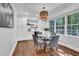 Bright dining area featuring modern decor, hardwood floors, and a charming wicker light fixture at 4669 Dunover Cir, Atlanta, GA 30360
