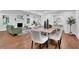 Open-concept dining room with hardwood floors, modern furniture, and plenty of natural light at 4669 Dunover Cir, Atlanta, GA 30360