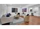 Comfortable living room with stylish decor, hardwood floors, and an open layout to the kitchen at 4669 Dunover Cir, Atlanta, GA 30360