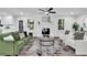 Bright living room featuring modern furniture, hardwood floors, and a decorative fireplace with white painted brick at 4669 Dunover Cir, Atlanta, GA 30360