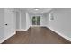 Living room featuring hardwood floors, white trim, a sliding glass door, and a window at 4669 Dunover Cir, Atlanta, GA 30360