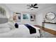 Bright main bedroom with fan, hardwood floors, closet, and stylish decor with modern art pieces at 4669 Dunover Cir, Atlanta, GA 30360