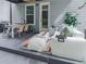 Relaxing backyard patio with a dining area, comfortable seating, and a modern fire pit for enjoying the outdoors at 499 Bishop Ln, Woodstock, GA 30188
