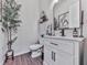 This powder room features modern vanity, a decorative mirror, and stylish decor elements at 499 Bishop Ln, Woodstock, GA 30188