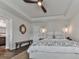 Bright bedroom featuring a tray ceiling, stylish decor, and an inviting sleeping space at 499 Bishop Ln, Woodstock, GA 30188