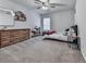 Spacious bedroom with carpeting, a ceiling fan, and ample natural light at 499 Bishop Ln, Woodstock, GA 30188