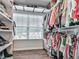 Walk-in closet with custom shelving and storage, offering ample space for shoes and clothes at 499 Bishop Ln, Woodstock, GA 30188