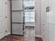 Custom closet with a sliding glass door showing storage for shoes and other clothing at 499 Bishop Ln, Woodstock, GA 30188