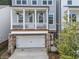 This beautiful home boasts a covered front porch, stone accents, and a convenient two-car garage at 499 Bishop Ln, Woodstock, GA 30188